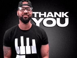 Video gif. Ty Blkbok with a beard and a backwards black baseball cap puts his hands together in gratitude then bows his head with a serene expression. Text, "Thank you."