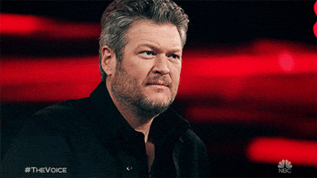 Reality TV gif. Blake Shelton on The Voice looks up at someone and nods his head strongly as he listens to them.
