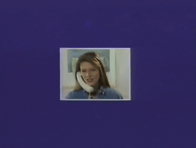 Gif of a 90s-looking commercial featuring a montage of white people on hands-free home telephones that strap to your head. 