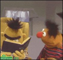 Muppets gif. Ernie smiles and bobs his head as Bert slowly looks up from a book and we zoom in on his stunned face.