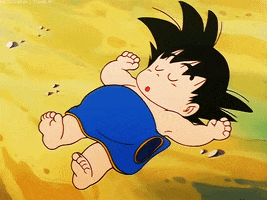 Anime gif. Young Goku from Dragon Ball series lies on his back on the ground, covered with a blue blanket, snoring while sound asleep.