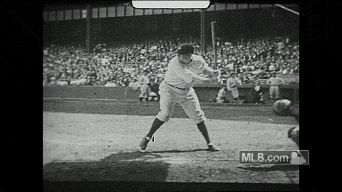 GIF showing Babe Ruth swinging a baseball bat, humorously referencing Livvy Dunne's rejected offer near his former residence.