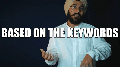 Animated GIF showing a hand typing 'Keywords' on a keyboard with a magnifying glass icon, indicating keyword research and analysis.