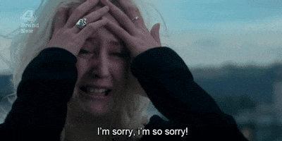 Video gif. A woman is sobbing and clutching her face, her hair completely disheveled. She has tears in her eyes as she says, "I'm sorry, I'm so sorry!"