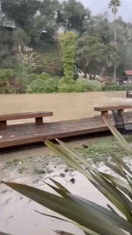 Washed-Away Deck Floats Down Flooded California Creek