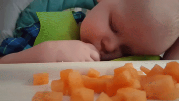 Baby Tries to Eat While Falling Asleep