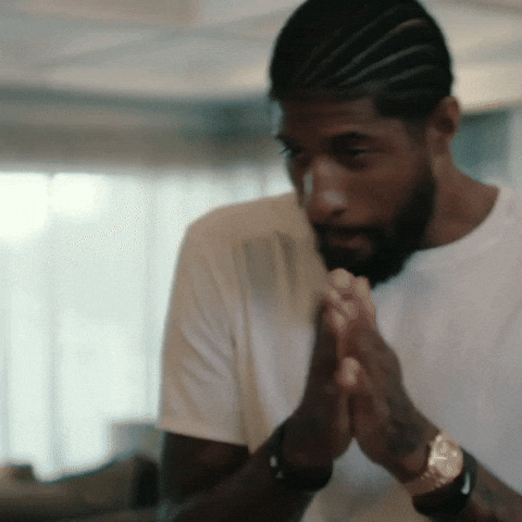 Sports gif. LA Clippers player Paul George rubs his palms together in anticipation.