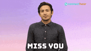 Video gif. Man looks at us with a gentle smile, taps at his temple with his index finger and then points at us. Text, "Miss you."