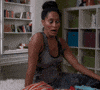 TV gif. Tracee Ellis Ross from Black-ish awkwardly sits on the edge of a bed, eyes wide. She raises her eyebrows and purses her lips dramatically as if to say “oops!”
