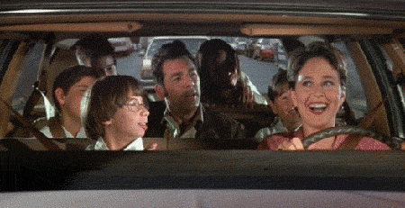 Seinfeld gif. In a crowded station wagon, a motherly woman drives while shaking her head with a smile. Several children in karate gis, along with Michael Richards as Kramer, cheer excitedly.