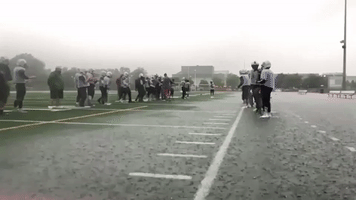 High-School Football Player Hydroplanes 10-Yards at End of Practice