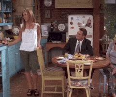Friends gif. Jennifer Aniston as Rachel whips her head around at something Chandler's said and responds with, "What?" She looks very annoyed with his antics.