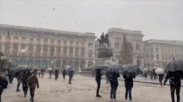 Flurries of Snow Fall at Milan's Landmark Duomo