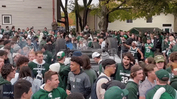 Explosion Scatters Revellers at Street Party for MSU College Football Victory