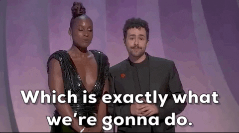 Oscars 2024 gif. Ramy stares sassily at us while Issa Rae says into the microphone, "Which is exactly what we're going to do."