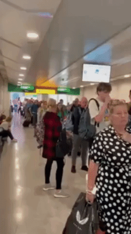 Travelers Wait in Long Lines at Heathrow Airport