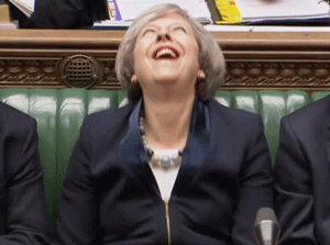 Politics gif. Theresa May is consumed with laughter, shaking her shoulders with each chuckle.