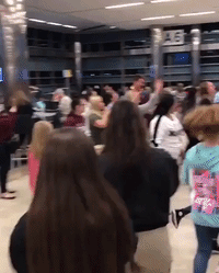 Spirit Airlines Employee Dances With Cheer Squad During Flight Delay
