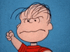 Peanuts gif. Linus furrows his brow and clenches his fists in anger showing clenched teeth.