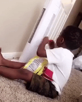 Little Boy Tries to Cool Spicy Chips With Fan