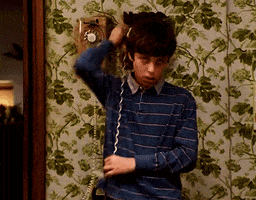 TV gif. John Francis Daley as Sam in Freaks and Geeks. There's a landline phone on the wall and he wraps the phone and the cord around his neck, pretending to choke himself.