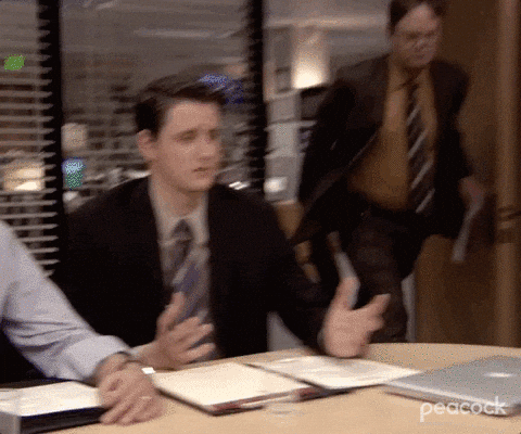 A man is rushing into an office and saying, "I WANT AN INTERVIEW."