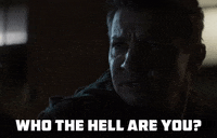 TV gif. Jeremy Renner as Clint Barton in Hawkeye furrows his brows in confusion as he says, “Who the hell are you?”