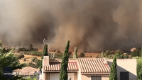 Dark Smoke Envelops Village as Wildfire Rages in South of France