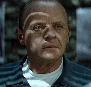 Movie gif. Dramatically lit and wearing his prison uniform, Anthony Hopkins as Hannibal Lecter from The Silence of the Lambs speaks to us with a straight face, then gives us a creepy smile. Text, "Thank you."