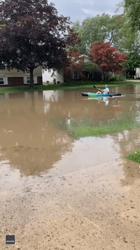 Crafty Residents Kayak Down Flooded Streets in Canton as Michigan Hit by Powerful Storms