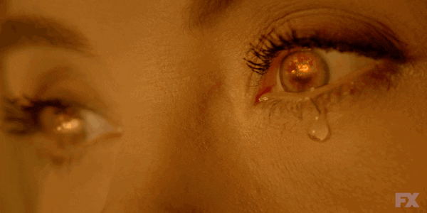 TV gif. Close up on Leslie Grossman as Meadow Wilton on American Horror Story Cult eyes.A single tear falls down her cheek and you can see flames reflected into her iris. 