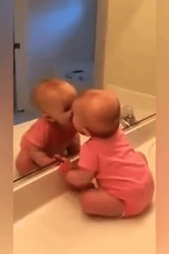 Baby Kisses Herself in Mirror