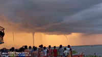 Four Waterspouts in Front of a Sunset Amaze Onlookers in Laguna de Bay, Philippines