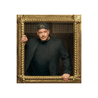 Sponsored sticker gif. Gold-framed portrait of Traitors cast member Rob Mariano pulses forward and back.