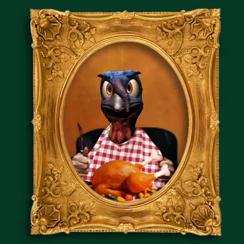 Digital art gif. A portrait of a turkey with a human body with a bib on and holding a fork and knife, sit in front of a roasted turkey. The human turkey gobbles and bangs it's silverware up and down impatiently and he roasted turkey quivers in fear. The portrait is in an ornate golden frame. 