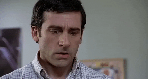 Movie gif. Steve Carrell as Andy in The 40 Year Old Virgin. His brows raise up into his forehead as he looks down at something in amazement. He says, "Wow," as he continues to stare.