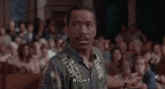 Movie gif. Obba Babatunde the interpreter in Born To Be Wild, sits on a bench pointing at a crowd behind him, as he gives someone a serious look and says, "Right."