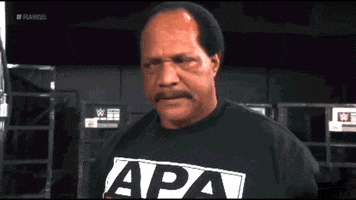 Video gif. Wrestler Ron Simmons shakes his head in anger as he turns toward us and says, "Damn."
