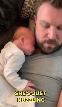 Baby Girl Cannot Get Enough of Dad's Scratchy Bear