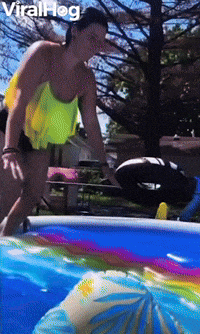 Woman Slides Straight Across Pool on Raft