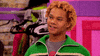 Reality TV gif. Chi Chi DeVayne on RuPaul's Drag Race is giving a catty raised eyebrow and smirk.