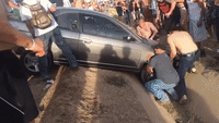 Festival Goers Come Together to Save a Trapped Driver