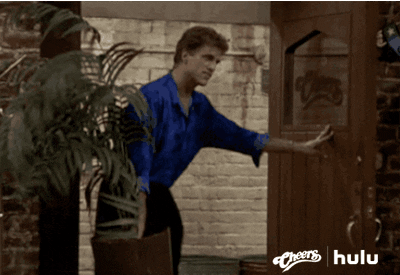 TV gif. Ted Danson as Sam on Cheers throws an indoor plant out the door.
