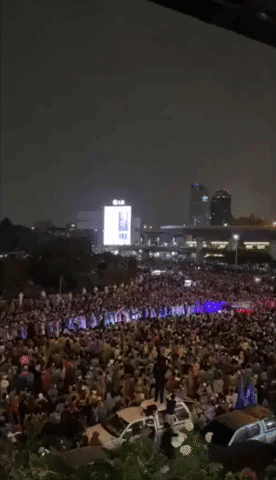 Crowds Gather Under Bangkok's Victory Monument as Protests Continue
