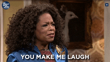 Tonight Show gif. Oprah says to someone, “you make me laugh.” and then she over exaggeratedly laughs, tilting her head back and moving her hand over her head as she laughs.