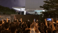 City Leader Issues Apology as Thousands Throng Hong Kong Streets