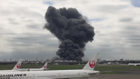Black Smoke at Tokyo Airport After Factory Fire