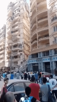 Crowd Gathers at Site of Alexandria Building Collapse