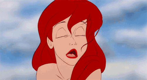 Disney gif. Ariel from the Little Mermaid exhales out of her mouth, frustrated, blowing her hair up off her forehead.
