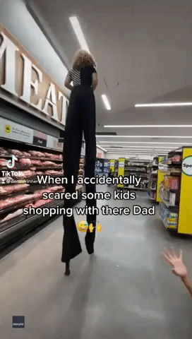 Woman on Stilts Surprises Shoppers in Australian Supermarket